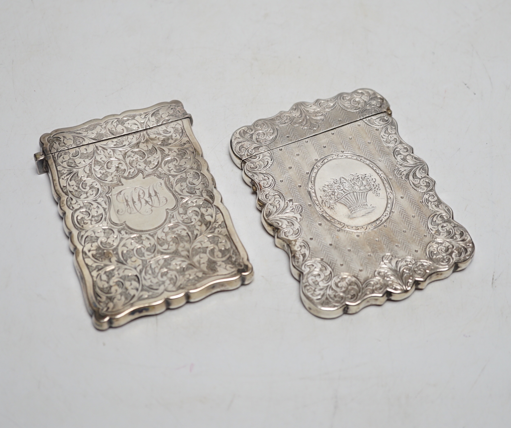 Two Victorian engraved silver card cases, largest by Hilliard & Thomasson, Birmingham, 1850, 10.1cm.
